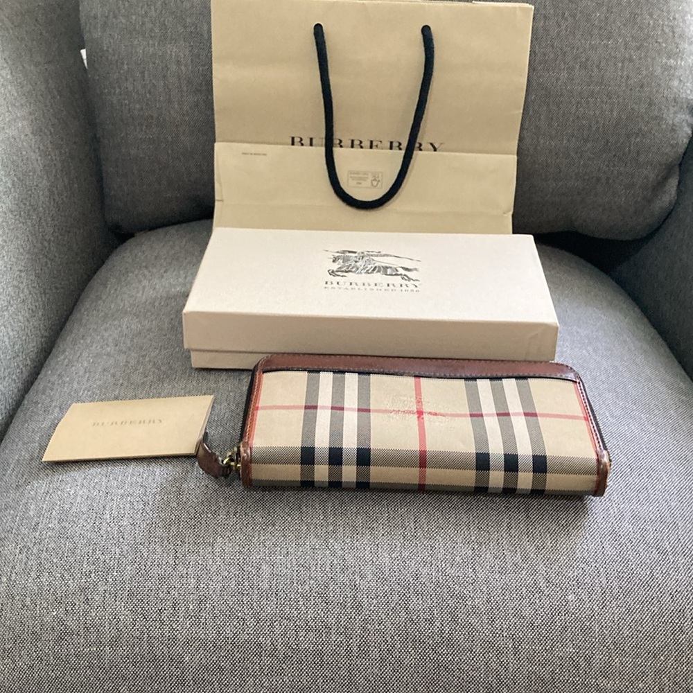 Authentic Burberry wallet. Very nice. Has been repaired by a cobbler. See pics